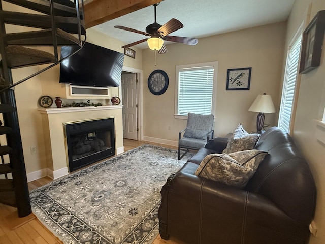 25 Bradley Ln, Bath Springs, TN 38311 - living area featuring ceiling fan, light wood finished floors, and a fireplace