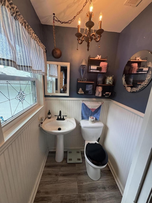 123 Coffman Dr, Fort Oglethorpe, GA 30742 - half bathroom featuring wainscoting, wood finished floors, and a chandelier