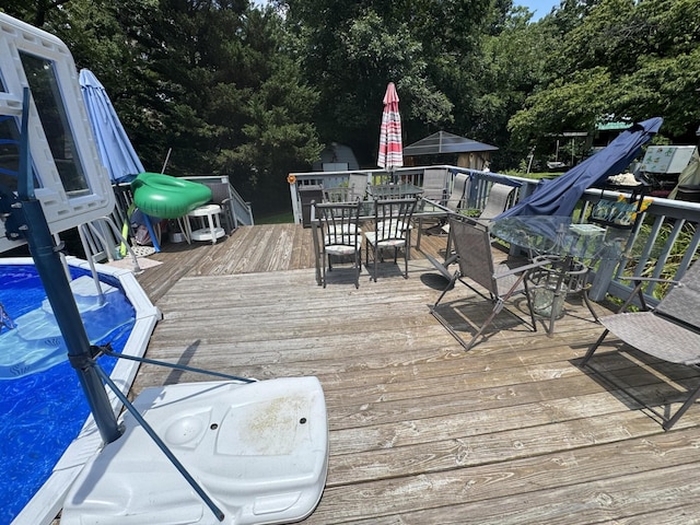 123 Coffman Dr, Fort Oglethorpe, GA 30742 - deck featuring outdoor dining space and view of wooded area