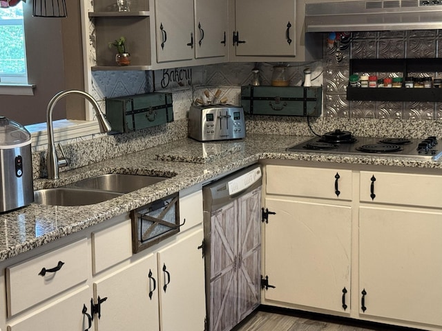 123 Coffman Dr, Fort Oglethorpe, GA 30742 - kitchen with stainless steel electric cooktop, under cabinet range hood, dishwasher, open shelves, and decorative backsplash