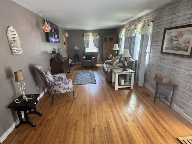 123 Coffman Dr, Fort Oglethorpe, GA 30742 - living area featuring wood finished floors and an accent wall