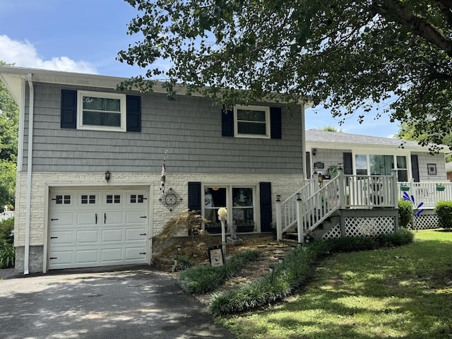 123 Coffman Dr, Fort Oglethorpe, GA 30742 - tri-level home with a garage, driveway, and a front lawn