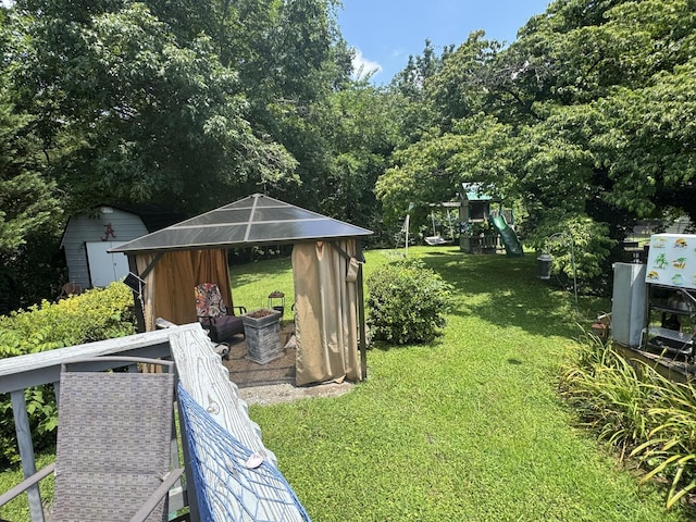 123 Coffman Dr, Fort Oglethorpe, GA 30742 - view of grassy yard featuring a playground and a shed