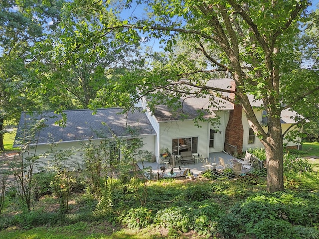 1201 Natchez Rd, Franklin, TN 37069 - back of house featuring a patio and roof with shingles