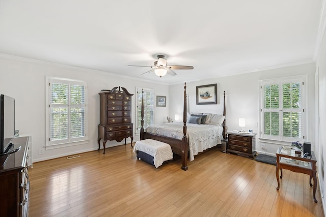 1201 Natchez Rd, Franklin, TN 37069 - bedroom featuring multiple windows, light wood-style floors, ornamental molding, and a ceiling fan