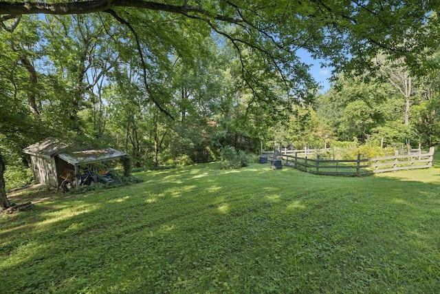 1201 Natchez Rd, Franklin, TN 37069 - view of yard featuring a storage shed and a view of trees