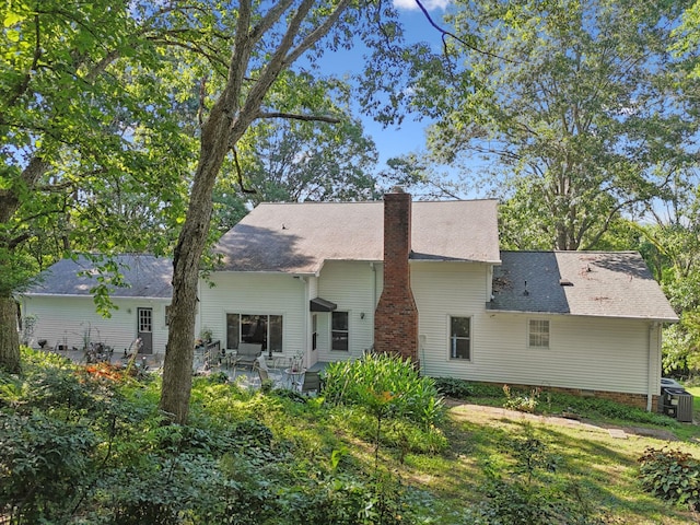 1201 Natchez Rd, Franklin, TN 37069 - rear view of property featuring a chimney, a patio, and a shingled roof