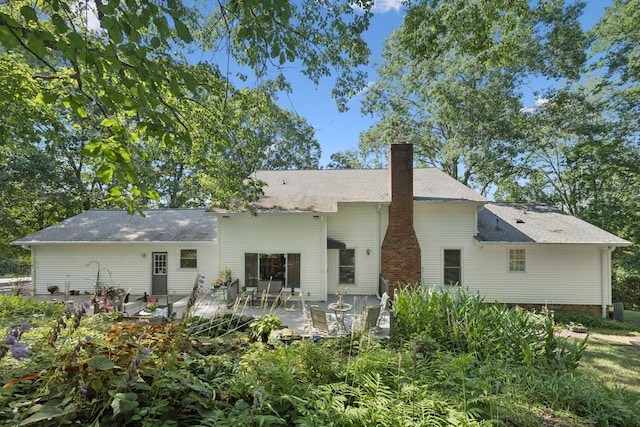1201 Natchez Rd, Franklin, TN 37069 - back of house with a chimney, a patio, and roof with shingles
