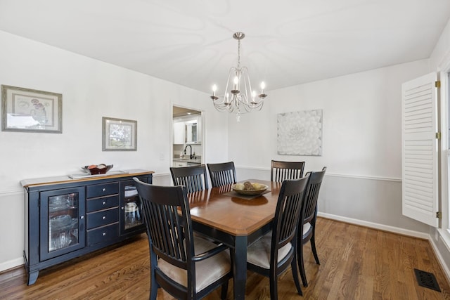 1201 Natchez Rd, Franklin, TN 37069 - dining area featuring a chandelier and dark wood-type flooring