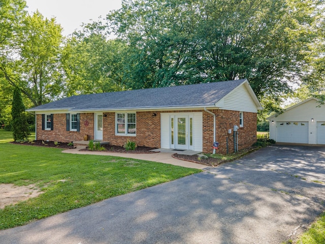 1150 Mattox Town Rd, Lawrenceburg, TN 38464 - ranch-style house featuring brick siding, an outbuilding, and a front yard