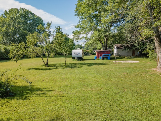 1150 Mattox Town Rd, Lawrenceburg, TN 38464 - view of grassy yard featuring a storage shed