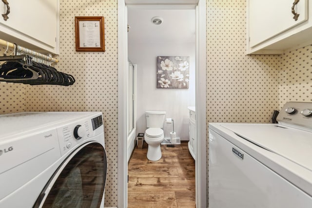 1150 Mattox Town Rd, Lawrenceburg, TN 38464 - laundry room with washer and dryer and wood finished floors