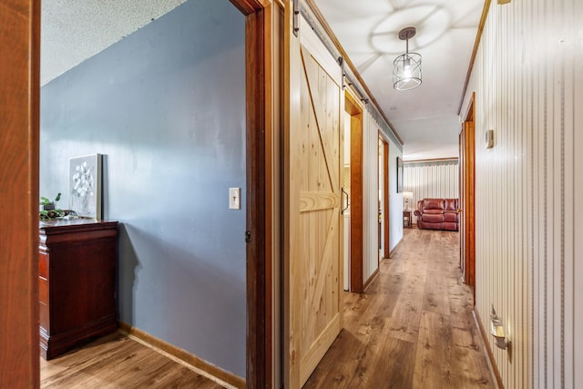 1150 Mattox Town Rd, Lawrenceburg, TN 38464 - hallway with wood finished floors and a barn door