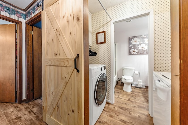 1150 Mattox Town Rd, Lawrenceburg, TN 38464 - washroom with wallpapered walls, washer / clothes dryer, and light wood-style floors