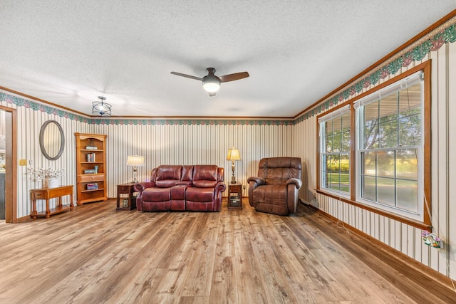 1150 Mattox Town Rd, Lawrenceburg, TN 38464 - living room featuring wallpapered walls, a textured ceiling, ceiling fan, wood finished floors, and ornamental molding