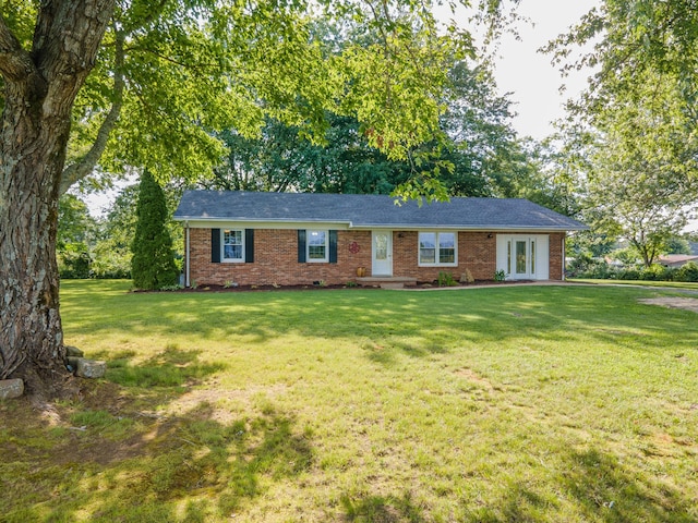1150 Mattox Town Rd, Lawrenceburg, TN 38464 - single story home featuring french doors, brick siding, and a front yard
