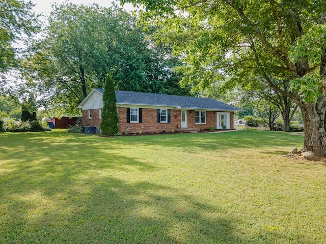 1150 Mattox Town Rd, Lawrenceburg, TN 38464 - ranch-style home with brick siding, a front lawn, and view of scattered trees