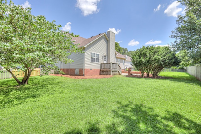 3307 Milton Ct, Thompsons Station, TN 37179 - back of property with a chimney, a fenced backyard, a wooden deck, and roof with shingles