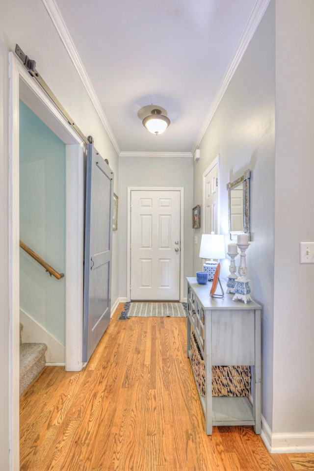 3307 Milton Ct, Thompsons Station, TN 37179 - hallway featuring crown molding, light wood-style flooring, stairway, and a barn door