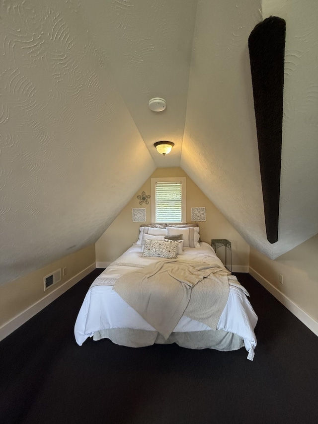 29 Bradley Ln, Bath Springs, TN 38311 - carpeted bedroom featuring vaulted ceiling and baseboards
