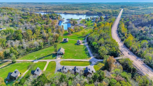 29 Bradley Ln, Bath Springs, TN 38311 - aerial overview of property's location featuring a nearby body of water and a heavily wooded area