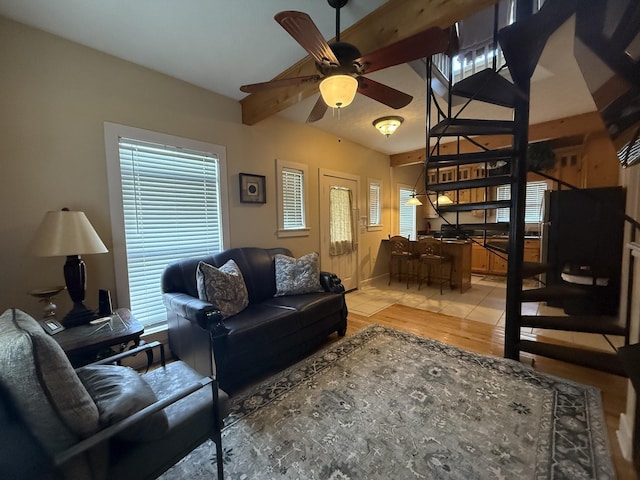 29 Bradley Ln, Bath Springs, TN 38311 - living room with a ceiling fan, light wood-style floors, beam ceiling, and stairs