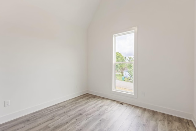 1111 W End Ave N, Lewisburg, TN 37091 - spare room with light wood finished floors and vaulted ceiling