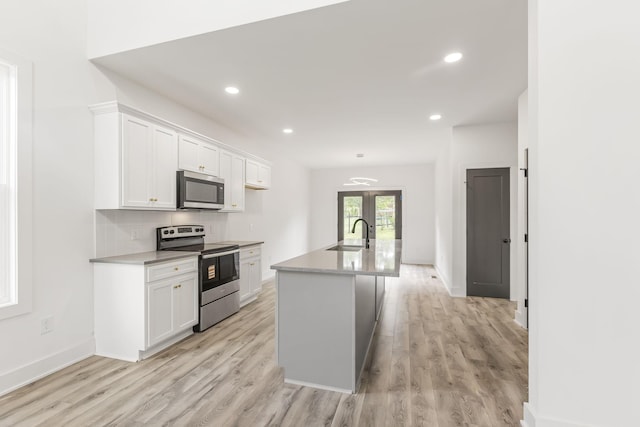 1111 W End Ave N, Lewisburg, TN 37091 - kitchen with appliances with stainless steel finishes, white cabinetry, light wood-style flooring, light countertops, and recessed lighting