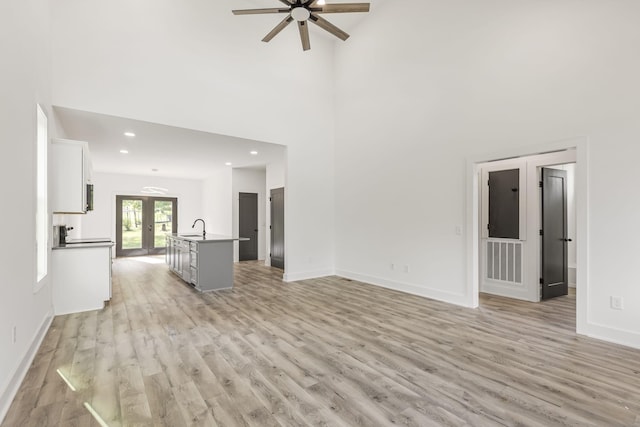 1111 W End Ave N, Lewisburg, TN 37091 - unfurnished living room featuring a ceiling fan, light wood-style flooring, french doors, a high ceiling, and recessed lighting