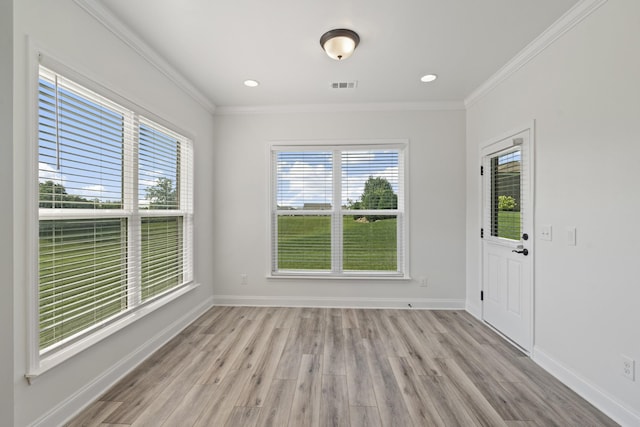 2039 Friendship Dr, Spring Hill, TN 37174 - unfurnished room featuring plenty of natural light, light wood-style floors, and crown molding