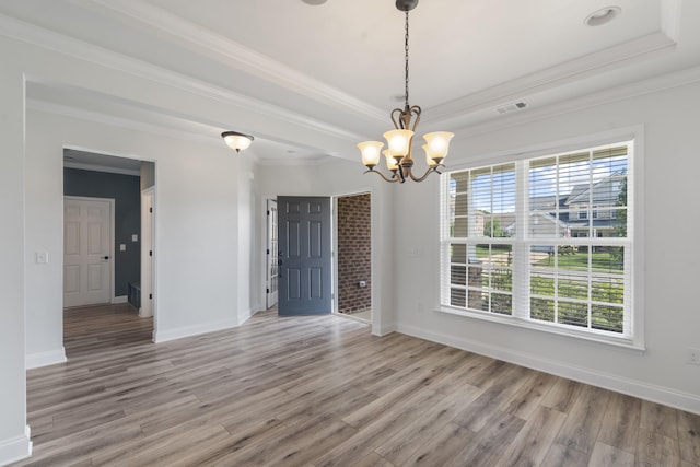 2039 Friendship Dr, Spring Hill, TN 37174 - unfurnished room featuring light wood finished floors, a chandelier, a tray ceiling, and crown molding