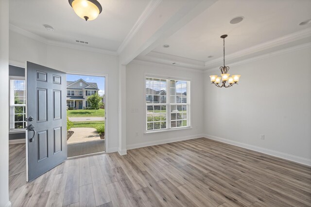 2039 Friendship Dr, Spring Hill, TN 37174 - entrance foyer with wood finished floors, a chandelier, ornamental molding, and a tray ceiling