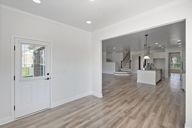 2039 Friendship Dr, Spring Hill, TN 37174 - foyer with ornamental molding, stairs, light wood-style floors, and recessed lighting