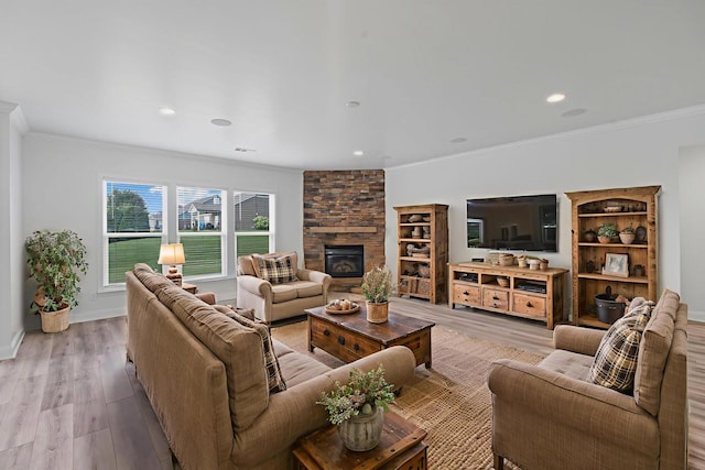2039 Friendship Dr, Spring Hill, TN 37174 - living room featuring light wood finished floors, ornamental molding, a fireplace, and recessed lighting