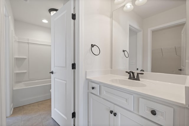 2039 Friendship Dr, Spring Hill, TN 37174 - full bathroom with vanity, tile patterned flooring,  shower combination, and a walk in closet