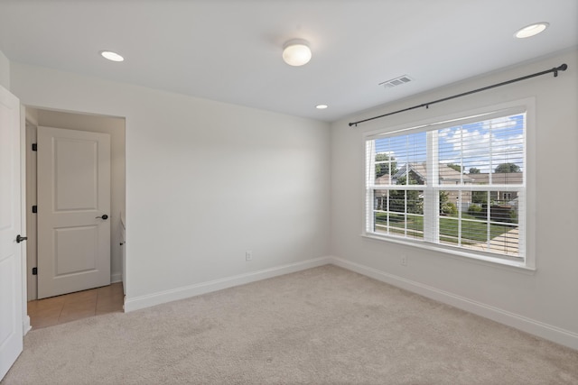 2039 Friendship Dr, Spring Hill, TN 37174 - unfurnished room featuring light colored carpet and recessed lighting