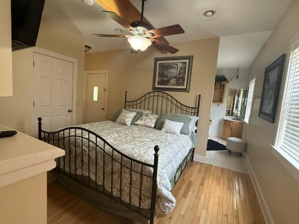 31 Bradley Ln, Bath Springs, TN 38311 - bedroom with light wood-type flooring and ceiling fan