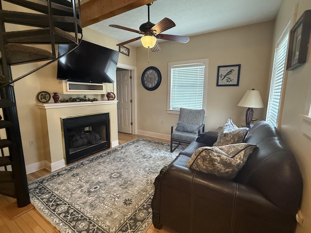 31 Bradley Ln, Bath Springs, TN 38311 - living area with a ceiling fan, light wood finished floors, and a fireplace