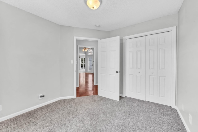 720 Superior Ln, Clarksville, TN 37043 - unfurnished bedroom with carpet flooring, a textured ceiling, and a closet
