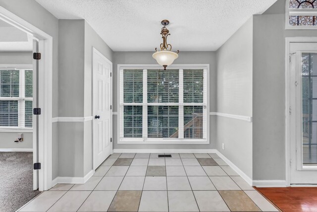 720 Superior Ln, Clarksville, TN 37043 - unfurnished dining area with plenty of natural light and a textured ceiling