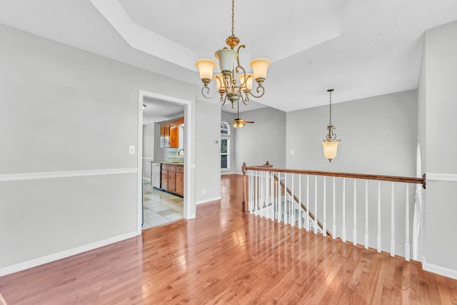720 Superior Ln, Clarksville, TN 37043 - empty room featuring a chandelier and light wood-style floors