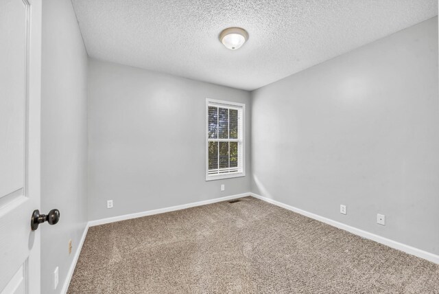 720 Superior Ln, Clarksville, TN 37043 - carpeted spare room featuring a textured ceiling and baseboards