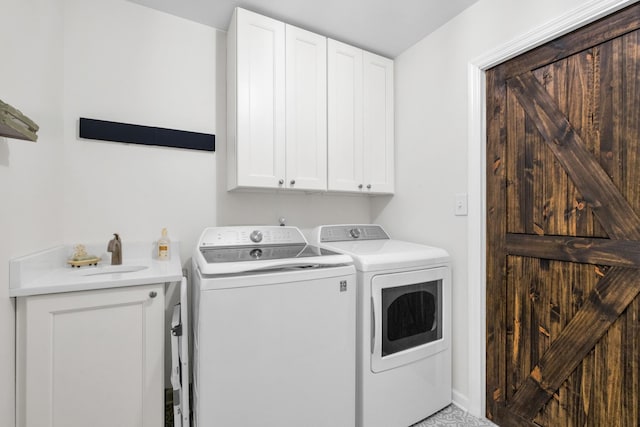 706 Running Deer Dr, Columbia, TN 38401 - laundry room featuring separate washer and dryer and cabinet space