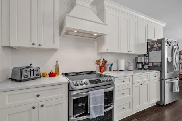 706 Running Deer Dr, Columbia, TN 38401 - kitchen with appliances with stainless steel finishes, custom exhaust hood, dark wood-type flooring, white cabinets, and light countertops