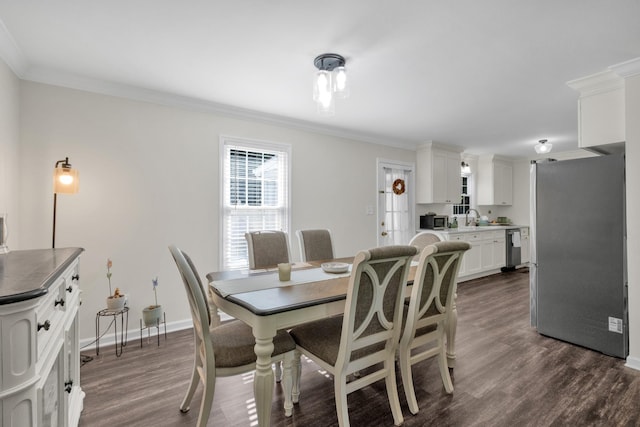 706 Running Deer Dr, Columbia, TN 38401 - dining area with dark wood finished floors and crown molding
