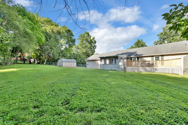 706 Running Deer Dr, Columbia, TN 38401 - view of yard with a deck and a storage shed
