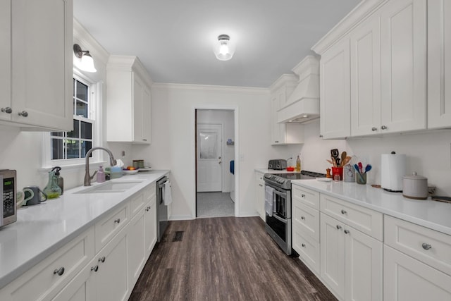 706 Running Deer Dr, Columbia, TN 38401 - kitchen with stainless steel appliances, premium range hood, dark wood-style flooring, and white cabinetry