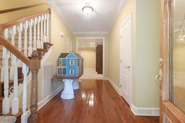 599 Countryside Dr, Loretto, TN 38469 - entrance foyer with wood finished floors, stairway, and crown molding