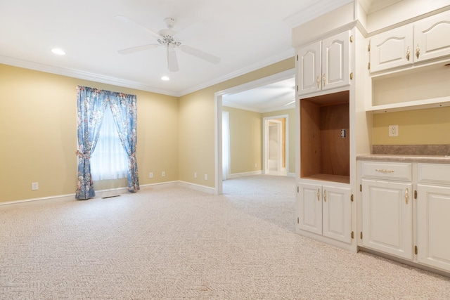 599 Countryside Dr, Loretto, TN 38469 - kitchen with crown molding, ceiling fan, light carpet, white cabinetry, and recessed lighting