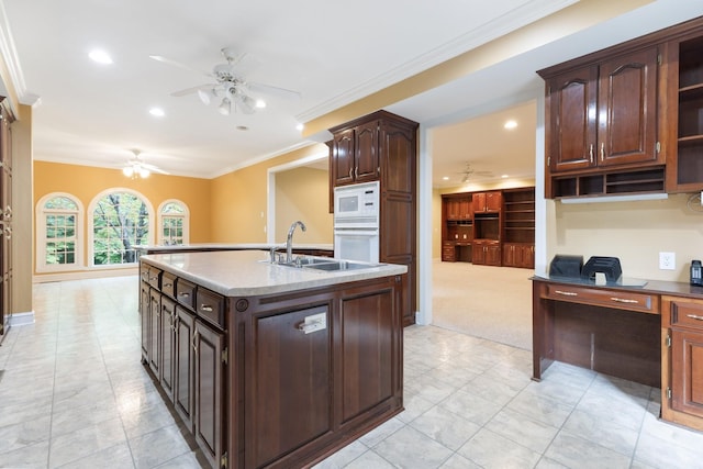 599 Countryside Dr, Loretto, TN 38469 - kitchen with ceiling fan, white appliances, a kitchen island with sink, ornamental molding, and an office area